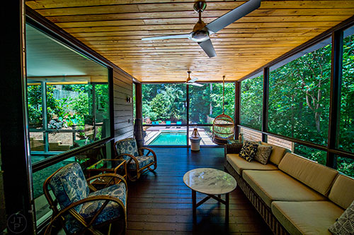 The screened in patio overlooks the salt water swimming pool and back yard at the Collier home, part of the Modern Atlanta Home Tour this year.