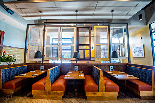 Screen doors hang over a section of the main dining room at Tupelo Honey.