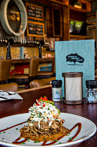 Tupelo Honey serves up the corn Johnny cake small plate with pulled pork, smoked jalapeno barbeque sauce and corn jalapeno slaw.