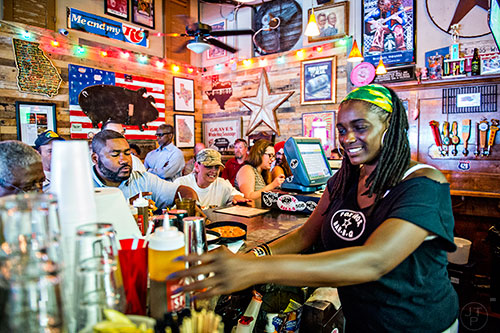 Tending bar during lunch time on a Tuesday at Fox Bros. Barbecue off of Dekalb Ave. in Atlanta.