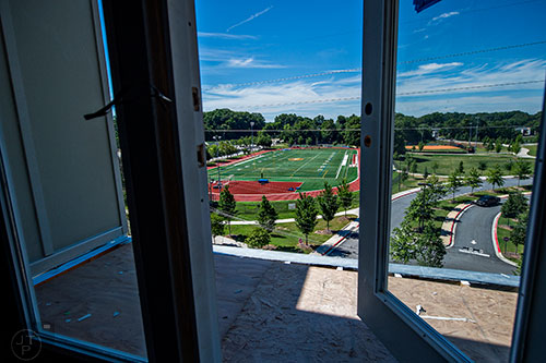 The football field at Maynard Jackson High School can be seen from the upper levels of the apartments attached to Glenwood Place in Atlanta.