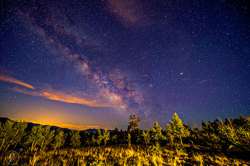 The Milky Way can be seen as stars and planets shine over Pike National Forest in Colorado on Friday, July 9, 2016.