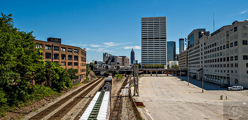 A train heads underneath Peters Street and into the city in the Castleberry Hill neighborhood of Atlanta.