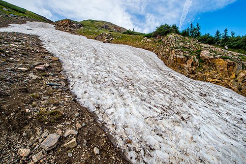A small snow field that is melting along Silver Dollar Lake Trail outside of Georgetown, Colorado on Sunday, July 24, 2016.