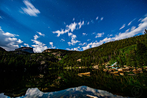 Stars shine in the sky over Bear Lake inside Rocky Mountain National Park in Colorado on Saturday, August 13, 2016.