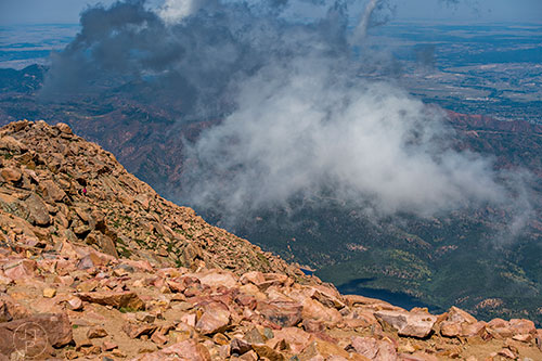 Hikers can be seen along the Barr Trail from the summit of Pikes Peak on Sunday, August 21, 2016.