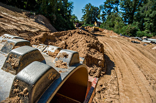 A piece of heavy machinery sits along the Atlanta Beltline's Westside Trail as construction continues.