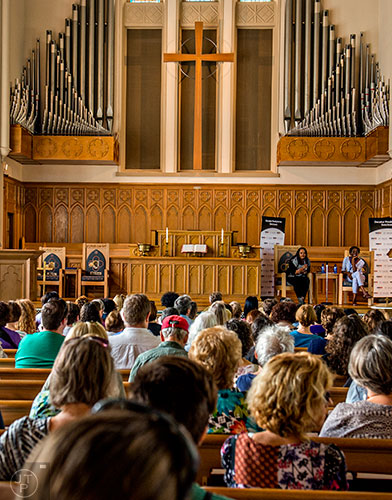 Author Jacqueline Woodson (right) speaks to the crowd while Valerie Boyd moderates during the Decatur Book Festival on Saturday.