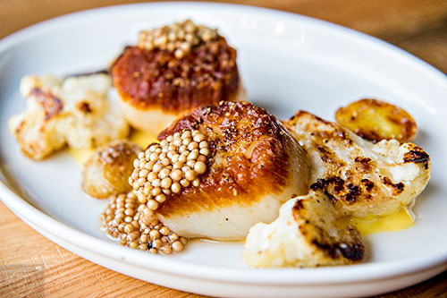 Double Zero serves up the scallops with corn, new potato, mustard seeds and cauliflower.