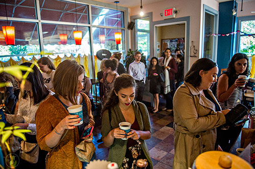 Customers wait to pay for their coffee inside JavaVino in Atlanta as the line to get in stretches outside during the Netflix Gilmore Girls Luke's Diner Takeover on Wednesday morning.