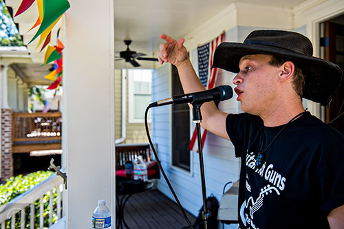 Collin Killtrick performs off of Olympic Pl. during the annual Oakhurst Porchfest on Saturday.