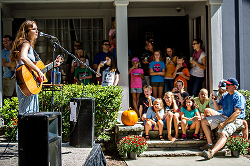 Sydney Rhame performs off of Mead Rd. during the annual Oakhurst PorchFest on Saturday.