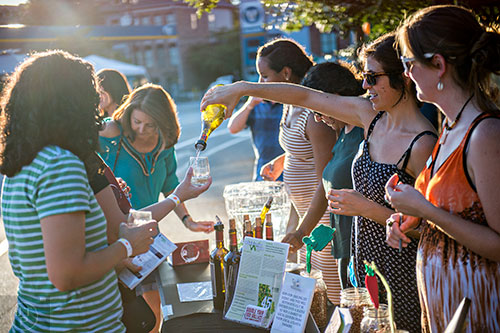 Sara Berney (right) pours wine during the Kirkwood Wine Stroll on Friday.