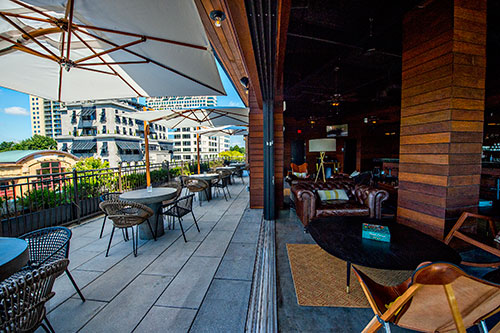 The indoor and outdoor seating options at The Regent Cocktail Club on the third floor at American Cut in Buckhead.