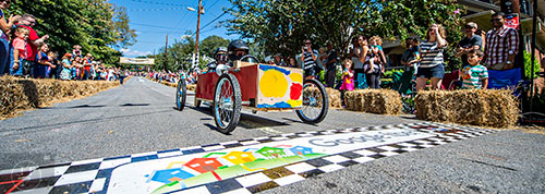 Jack Brown and Theo Reynolds cross the finish line during the 6th annual Madison Ave. Soapbox Derby in Oakhurst on Saturday.