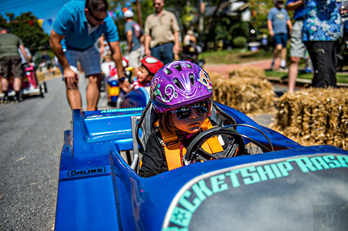 Sloane Rasberry waits for her turn to race during the 6th annual Madison Ave. Soapbox Derby in Oakhurst on Saturday.