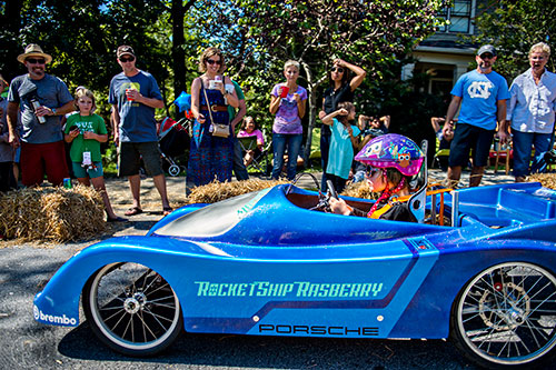 Sloane Rasberry takes off from the starting line as she steers her car down the street during the 6th annual Madison Ave. Soapbox Derby in Oakhurst on Saturday.