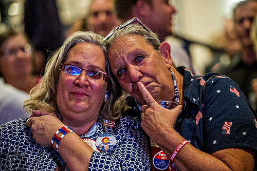 Laurel Imer (left) and Robyn McMillen get a little emotional as they watch poll results come in during the GOP Election Party at the Tech Center Doubletree Hotel in Denver on Tuesday, November 8, 2016. "All of our hard work is paying off," said Imer. "I see that we're taking back our country," said McMillen.