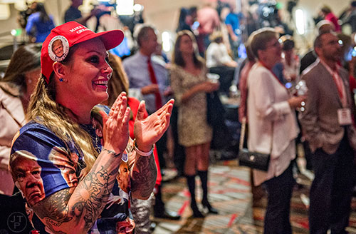 Leelee Fertig (left) claps and cheers as states are called Republican during the GOP Election Party at the Tech Center Doubletree Hotel in Denver on Tuesday, November 8, 2016.