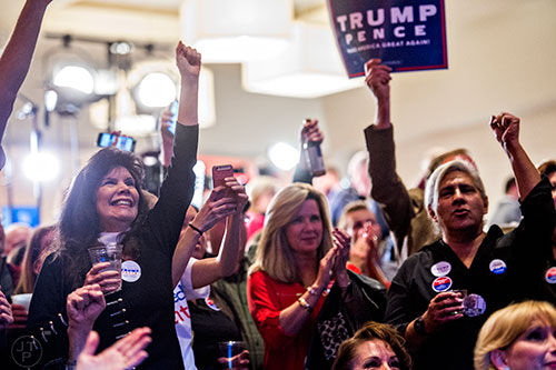 The crowd reacts as FOX News calls Ohio for Trump during the GOP Election Party at the Tech Center Doubletree Hotel in Denver on Tuesday, November 8, 2016.