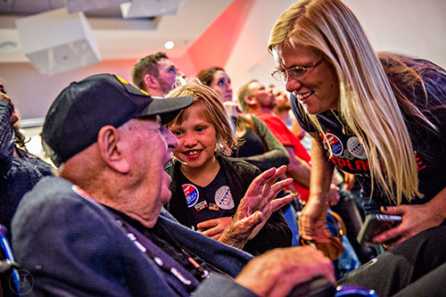Carey McGrath (right) and her daughter Esther speak to WWII veteran Sidney Walton during the GOP Election Party at the Tech Center Doubletree Hotel in Denver on Tuesday, November 8, 2016.
