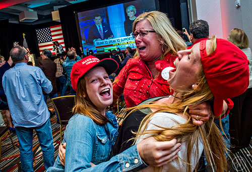 Claire Sorenson (left), her sister Brooke (right) and Denise Black react as Donald Trump is named President elect during the GOP Election Party at the Tech Center Doubletree Hotel in Denver on Tuesday, November 8, 2016.