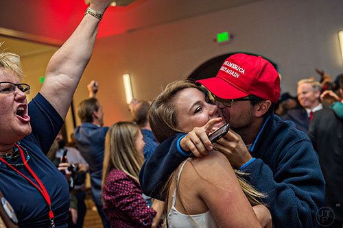 The crowd reacts as Donald Trump is named President elect during the GOP Election Party at the Tech Center Doubletree Hotel in Denver on Tuesday, November 8, 2016.