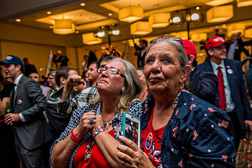 Robyn McMillen (right) and Laurel Imer react as Donald Trump is named President elect during the GOP Election Party at the Tech Center Doubletree Hotel in Denver on Tuesday, November 8, 2016.